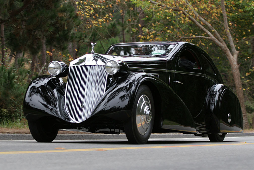 Vintage sepia-toned image of a sedan with cantilevered hoods and stained-glass windows, Prairie School style